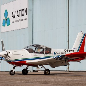 Aircraft in front of hangar