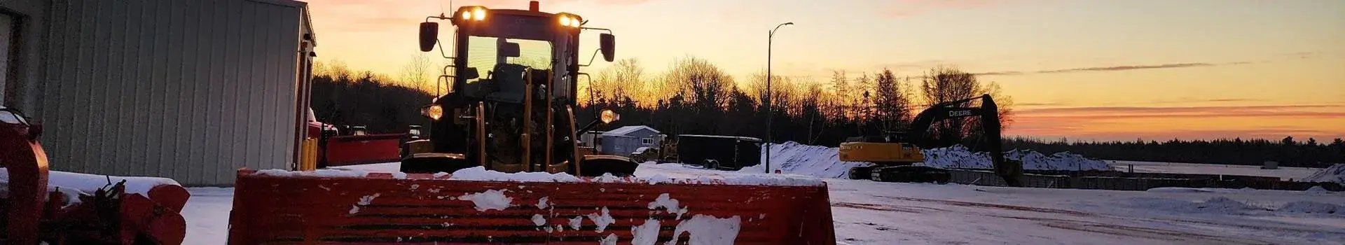 Airport heavy machinery in winter lot
